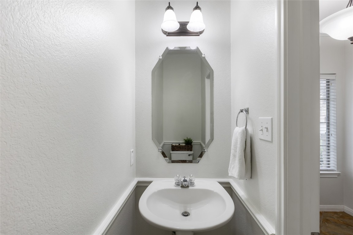 11237 Lost Maples Trail Austin, TX 78748 - Photo 15 of 35 a bathroom with a sink and a mirror