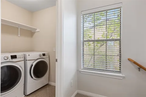 a en suite bathroom with a double vanity sink and a mirror