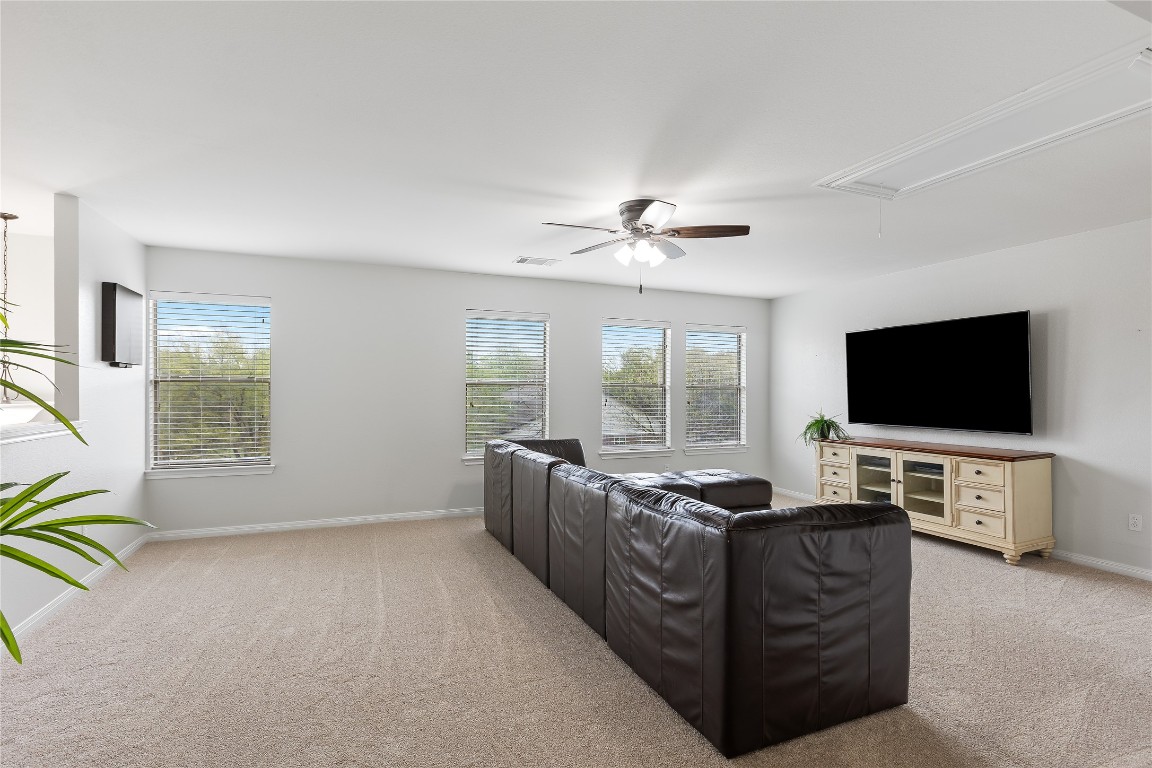 11237 Lost Maples Trail Austin, TX 78748 - Photo 24 of 35 a living room with furniture and a flat screen tv