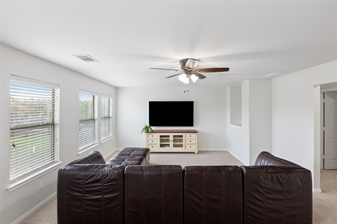 11237 Lost Maples Trail Austin, TX 78748 - Photo 26 of 35 a bedroom with a bed and a flat screen tv