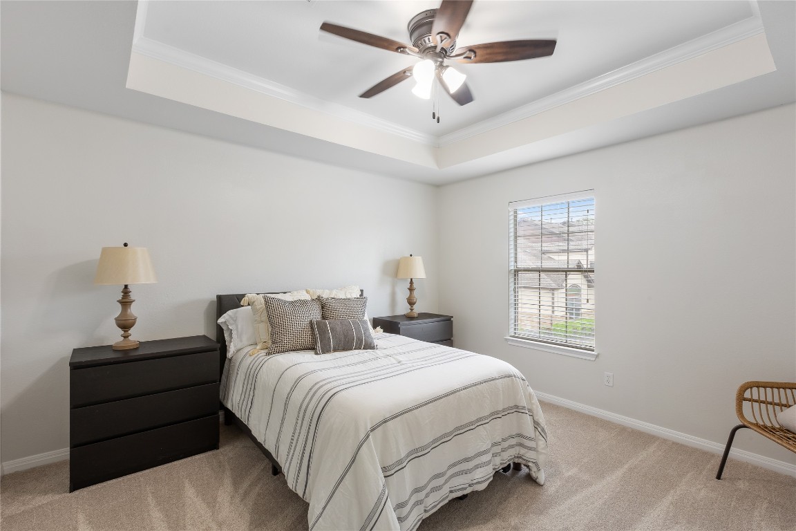 11237 Lost Maples Trail Austin, TX 78748 - Photo 27 of 35 a bedroom with a large bed and a window