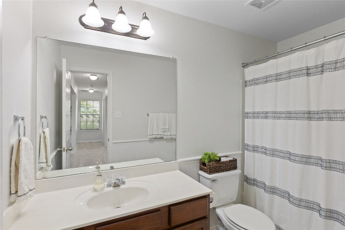 11237 Lost Maples Trail Austin, TX 78748 - Photo 30 of 35 a bathroom with a sink toilet a mirror and shower