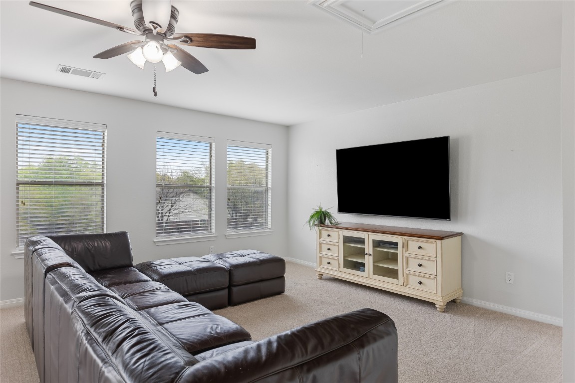 11237 Lost Maples Trail Austin, TX 78748 - Photo 2 of 35 a living room with furniture and a flat screen tv