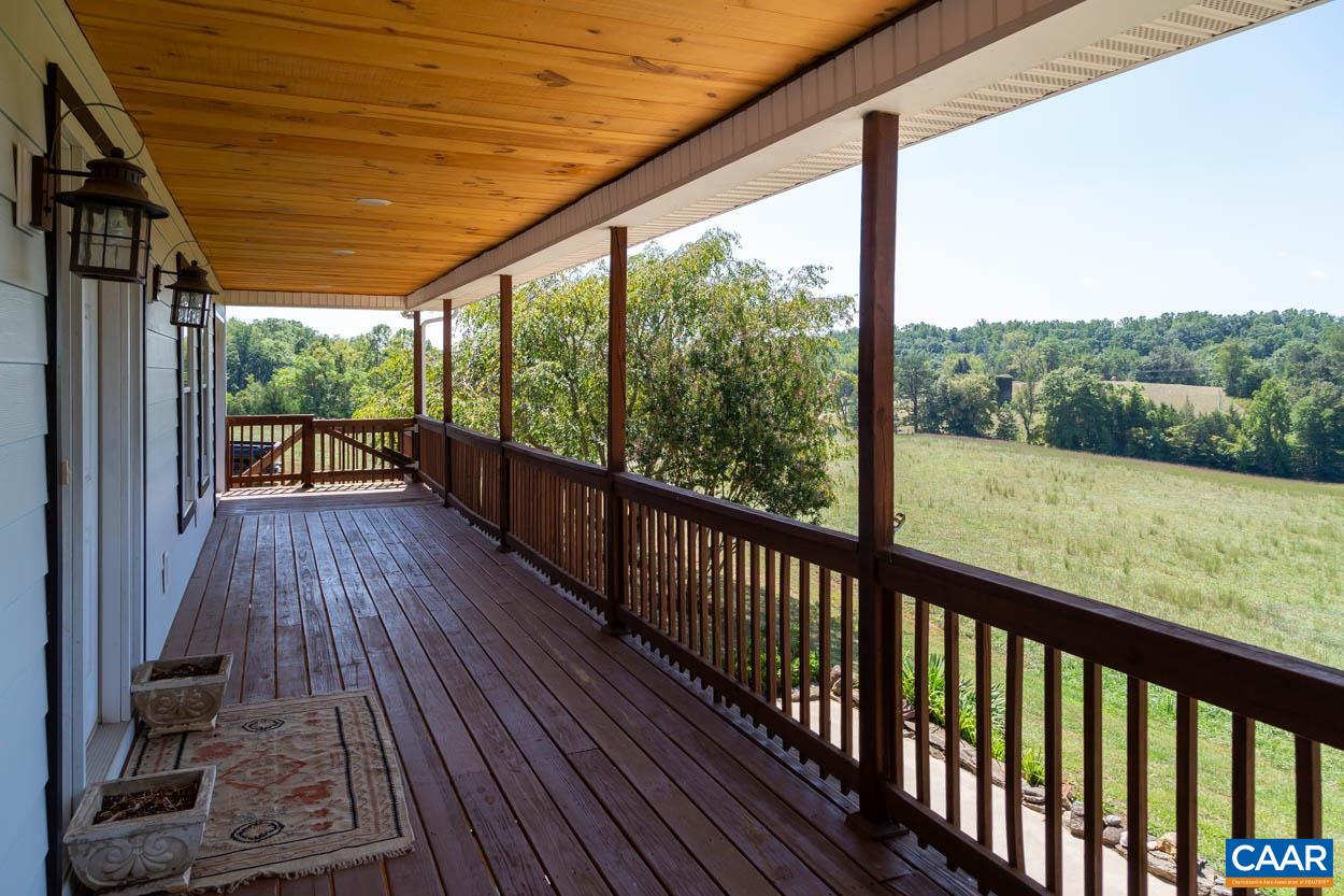 5289 Free Union Road Free Union, VA 22940 - Photo 11 of 63 a view of a balcony with wooden floor