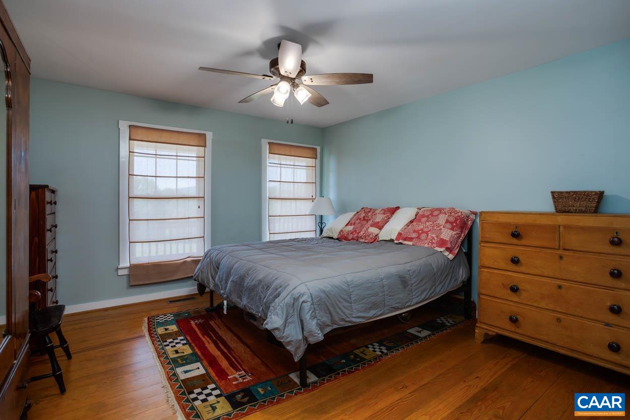 5289 Free Union Road Free Union, VA 22940 - Photo 37 of 63 a bedroom with a bed and a dresser
