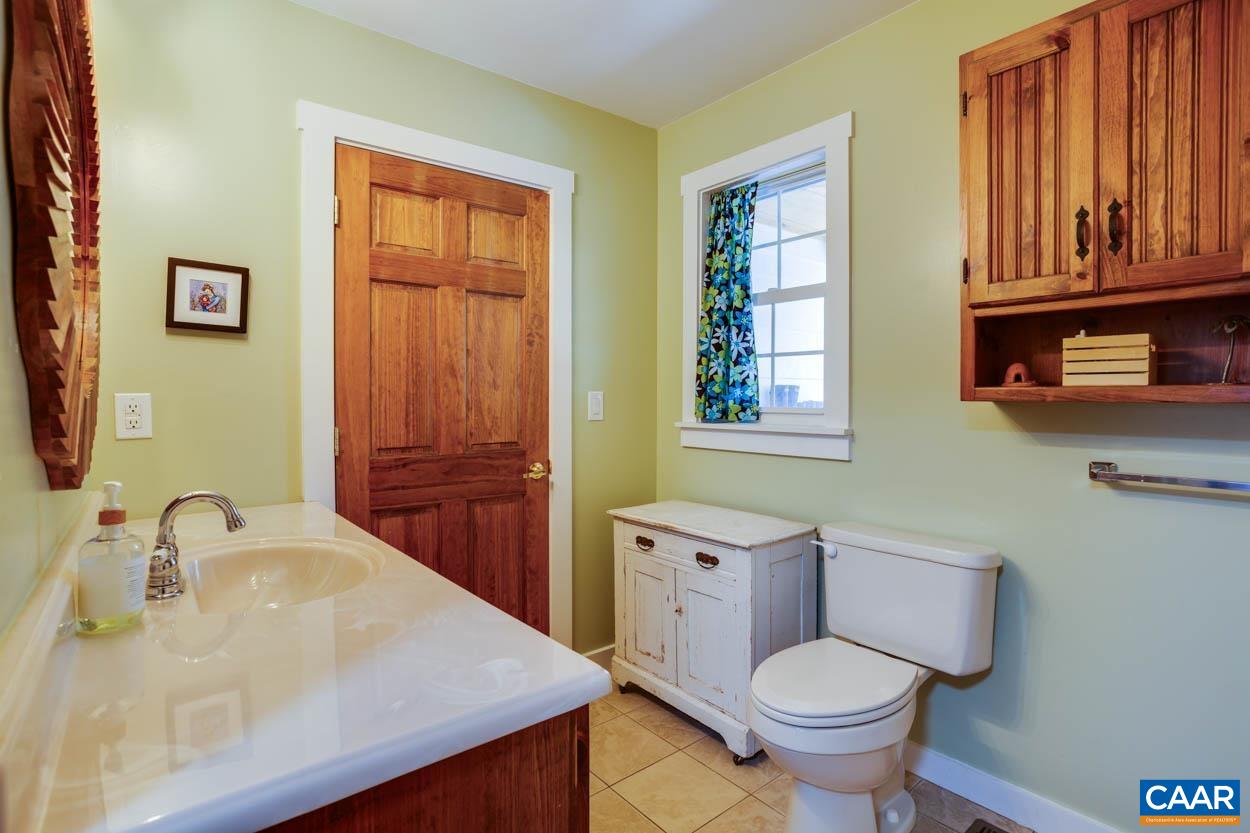 5289 Free Union Road Free Union, VA 22940 - Photo 38 of 63 a bathroom with a toilet sink and mirror