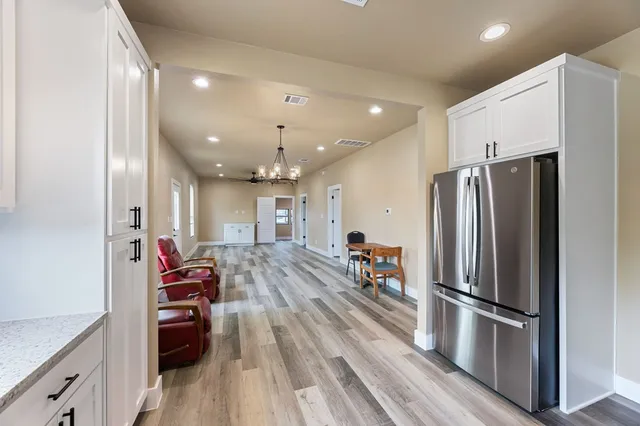 a kitchen with stainless steel appliances a refrigerator and a stove