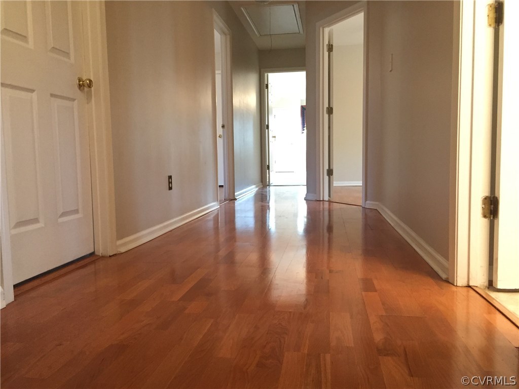 3807 Doe Run Road Hopewell, VA 23860 - Photo 21 of 29 a view of an empty room with wooden floor and a window