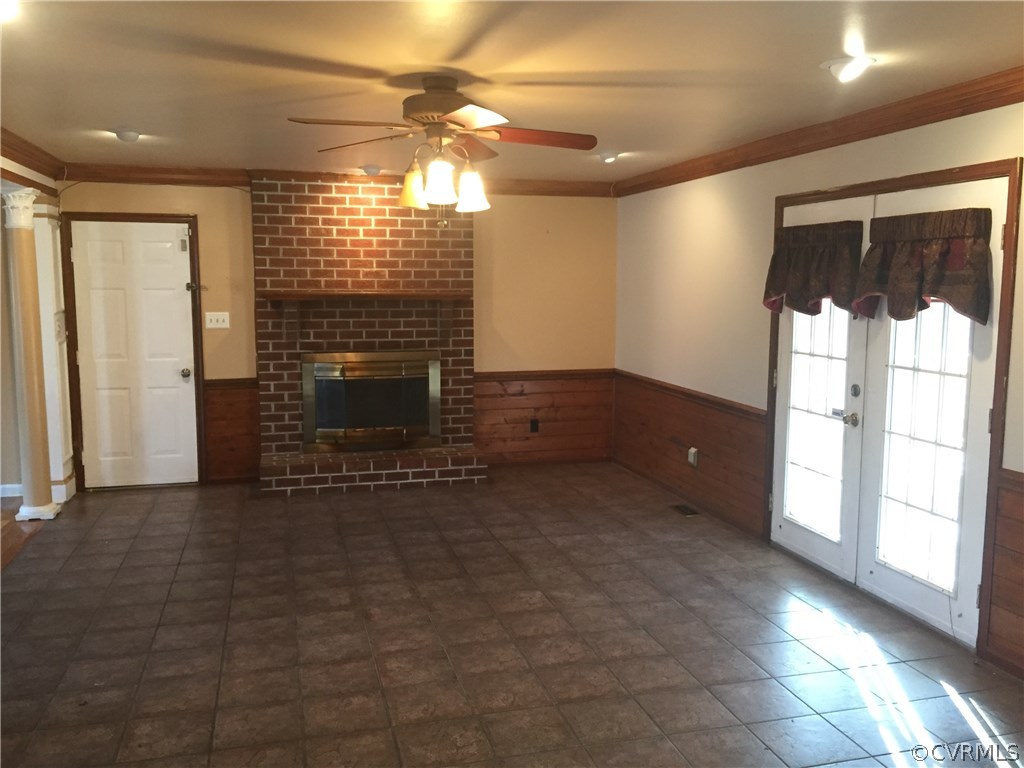 3807 Doe Run Road Hopewell, VA 23860 - Photo 7 of 29 a view of empty room with floor to ceiling window and fireplace