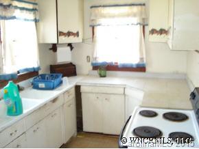 678 Old Clyde Road Clyde, NC 28721 - Photo 7 of 8 a kitchen with a sink and a stove