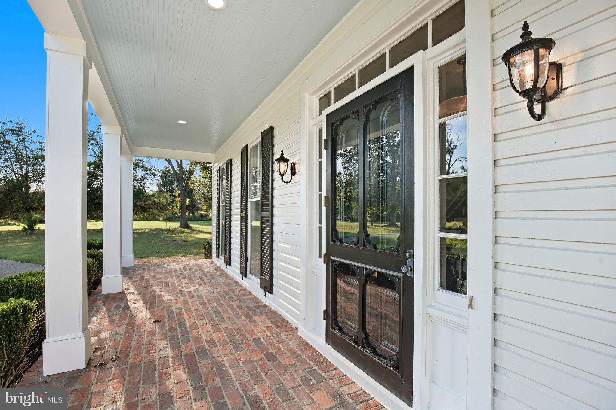 5965 Acorn Spring Place La Plata, MD 20646 - Photo 2 of 54 a view of a porch with wooden floor and iron stairs