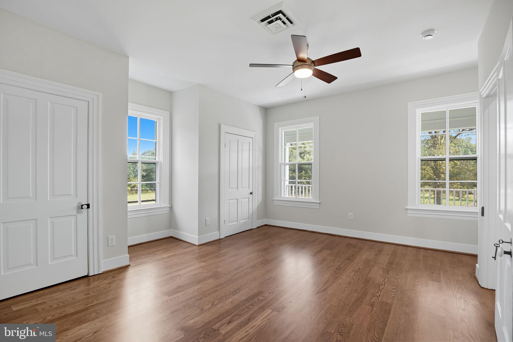 5965 Acorn Spring Place La Plata, MD 20646 - Photo 28 of 54 a view of an empty room with wooden floor and a window