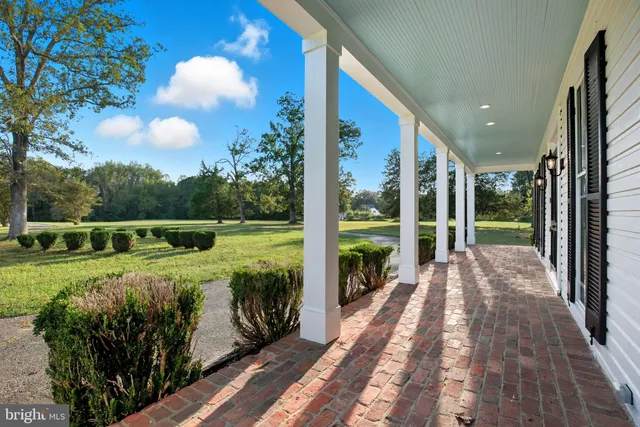 a view of balcony with deck and yard
