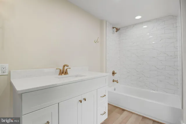 a bathroom with a sink and a large window