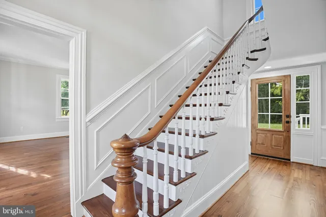 a view of entryway with wooden floor
