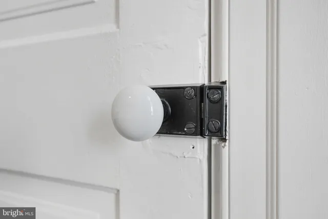 a view of a white house with a yard