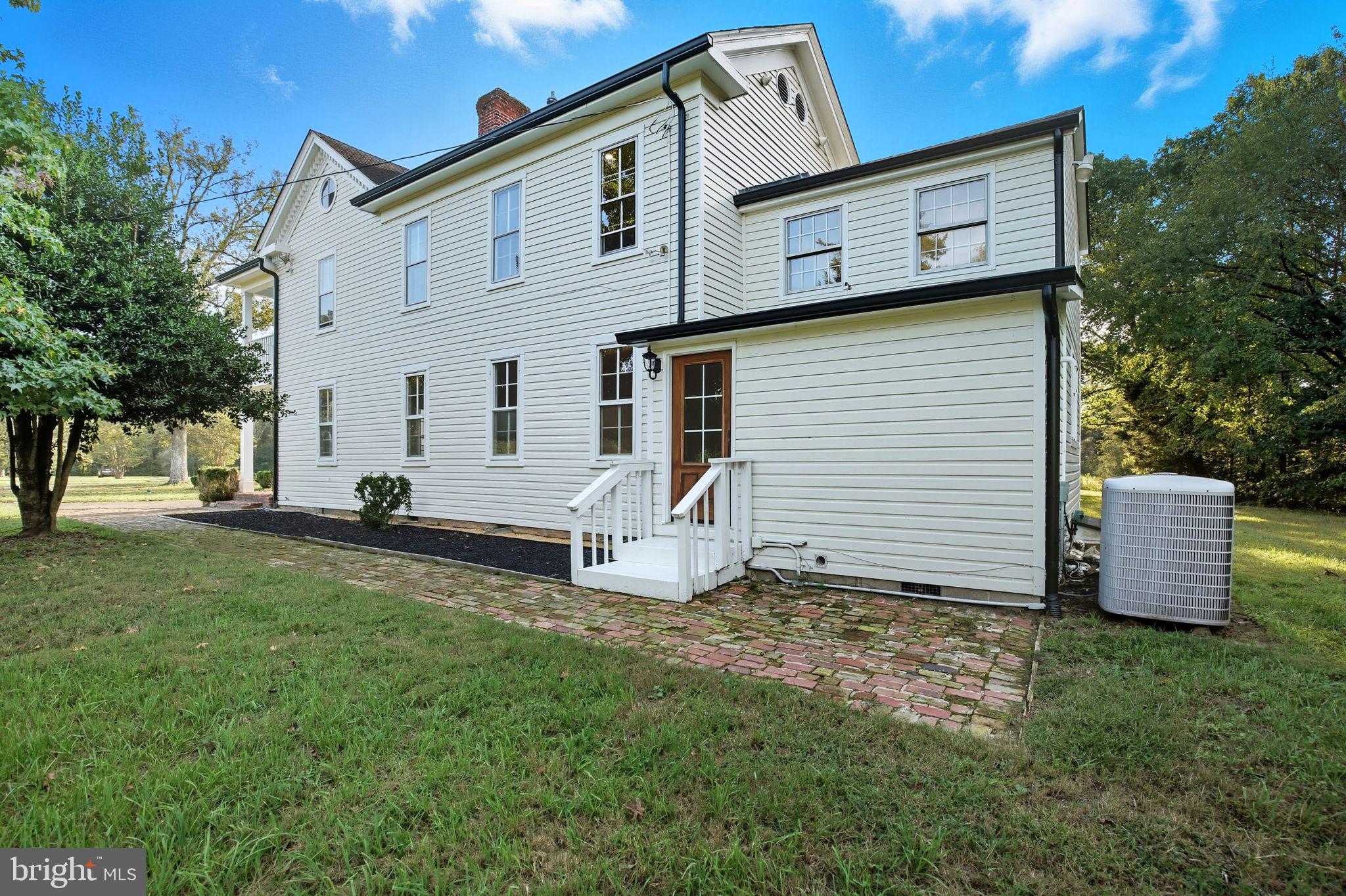 5965 Acorn Spring Place La Plata, MD 20646 - Photo 50 of 54 a view of a white house with a yard