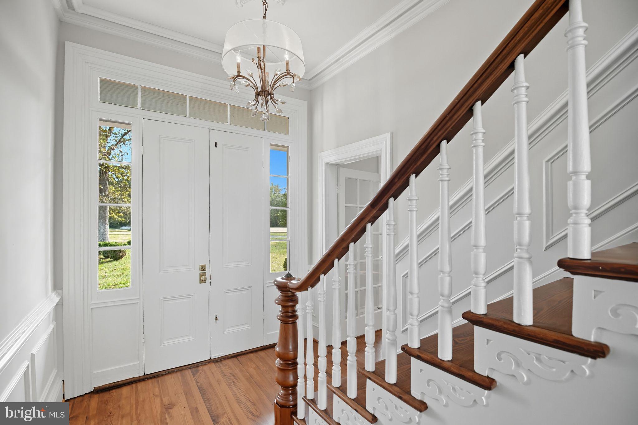5965 Acorn Spring Place La Plata, MD 20646 - Photo 5 of 54 a view of entryway with stairs and wooden floor