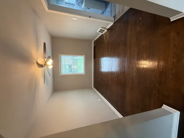 a bathroom with a toilet sink and window