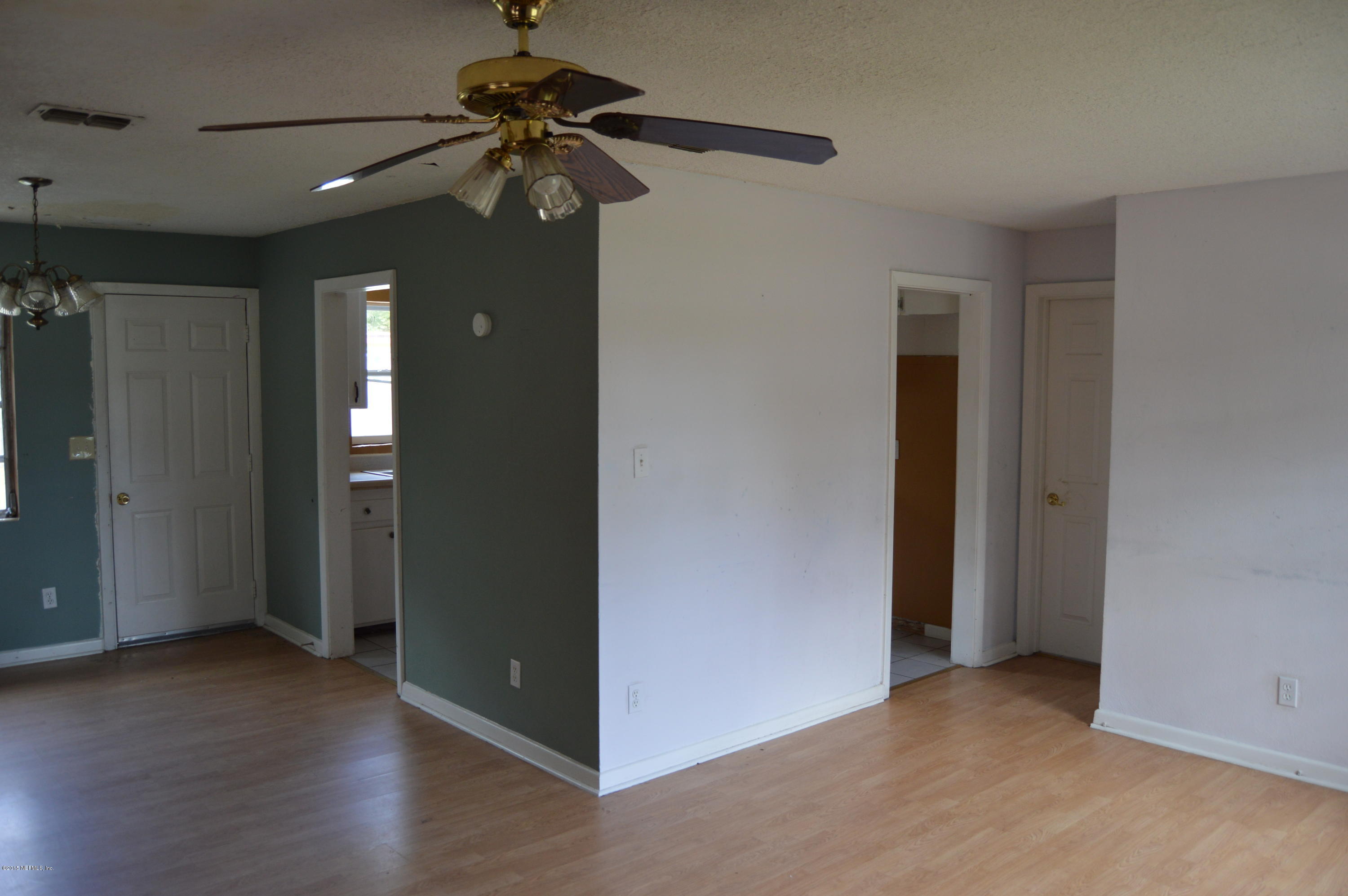 2236 Dean Road Jacksonville, FL 32216 - Photo 12 of 21 a view of a livingroom with a chandelier fan