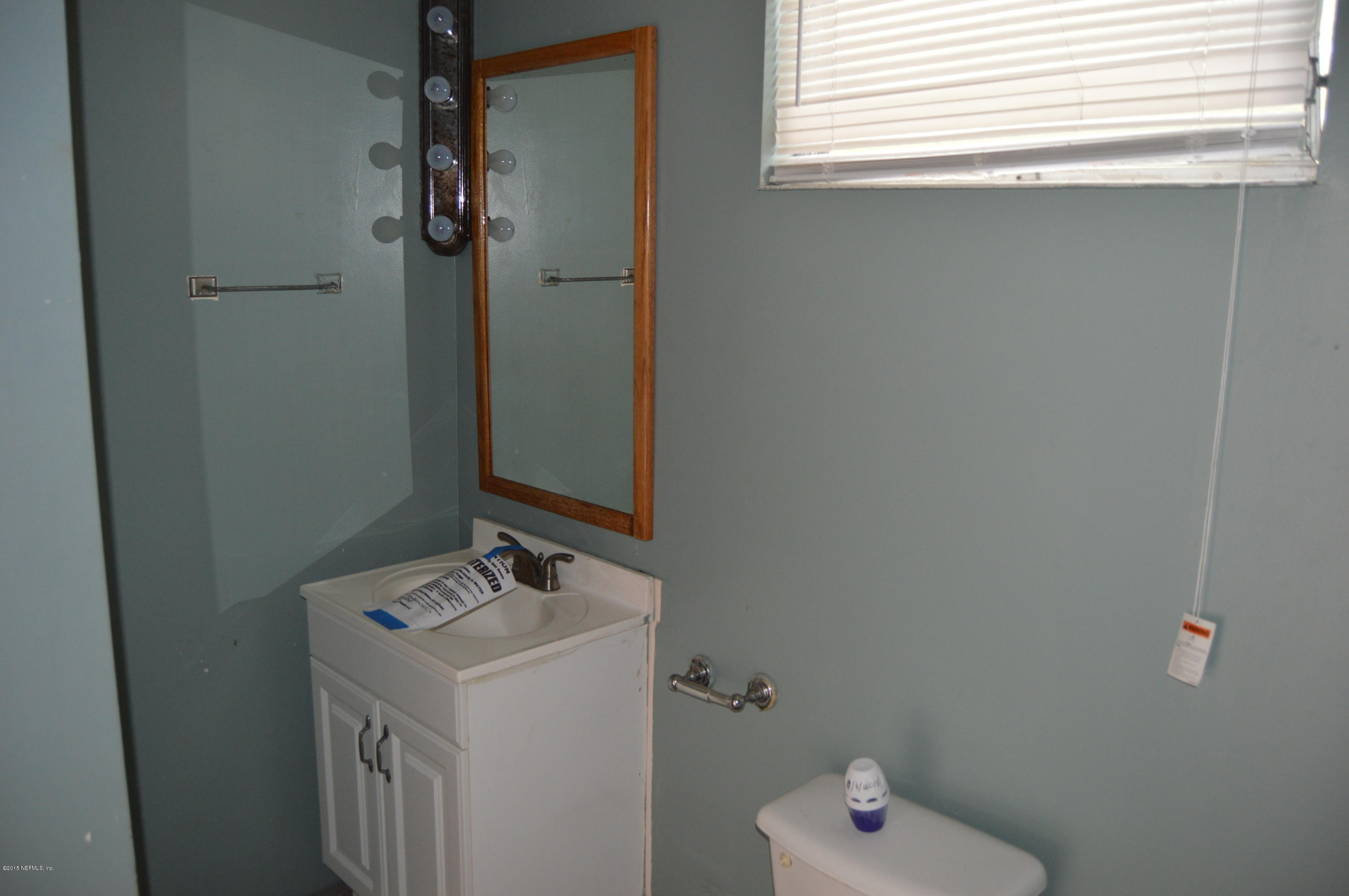 2236 Dean Road Jacksonville, FL 32216 - Photo 17 of 21 a bathroom with a sink a toilet and shower