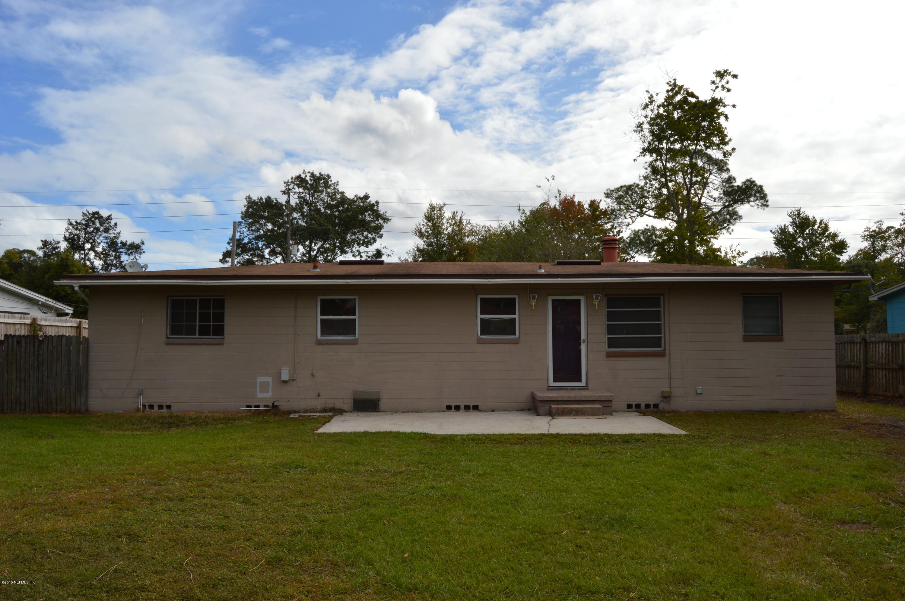 2236 Dean Road Jacksonville, FL 32216 - Photo 20 of 21 a backyard of a house with lots of green space