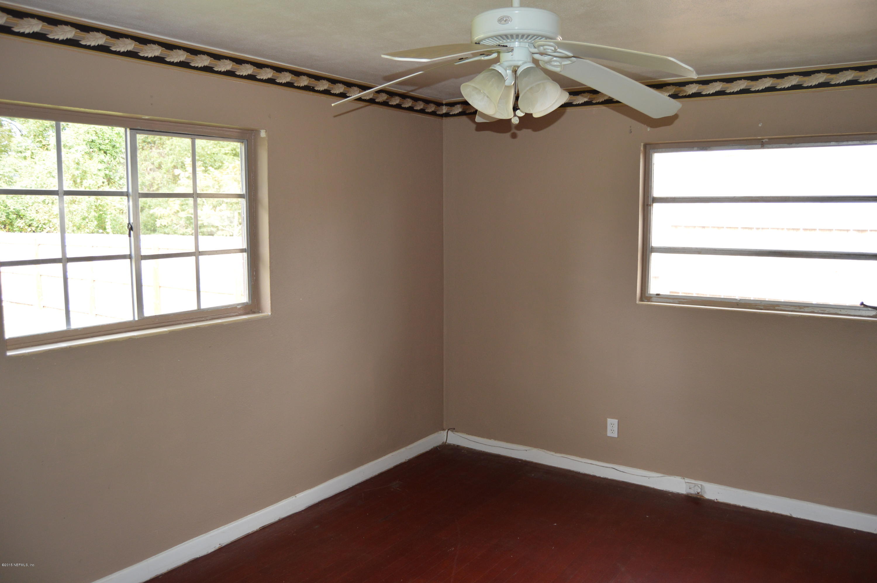 2236 Dean Road Jacksonville, FL 32216 - Photo 5 of 21 an empty room with a window