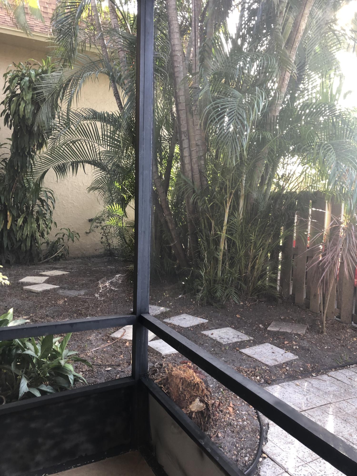 1291 Northwest 13th Street, Unit 346D Boca Raton, FL 33486 - Photo 13 of 15 a view of a porch with a tree