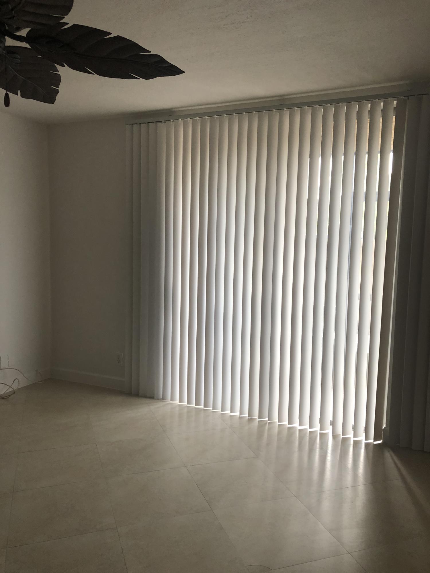 1291 Northwest 13th Street, Unit 346D Boca Raton, FL 33486 - Photo 6 of 15 a view of an empty room with a window