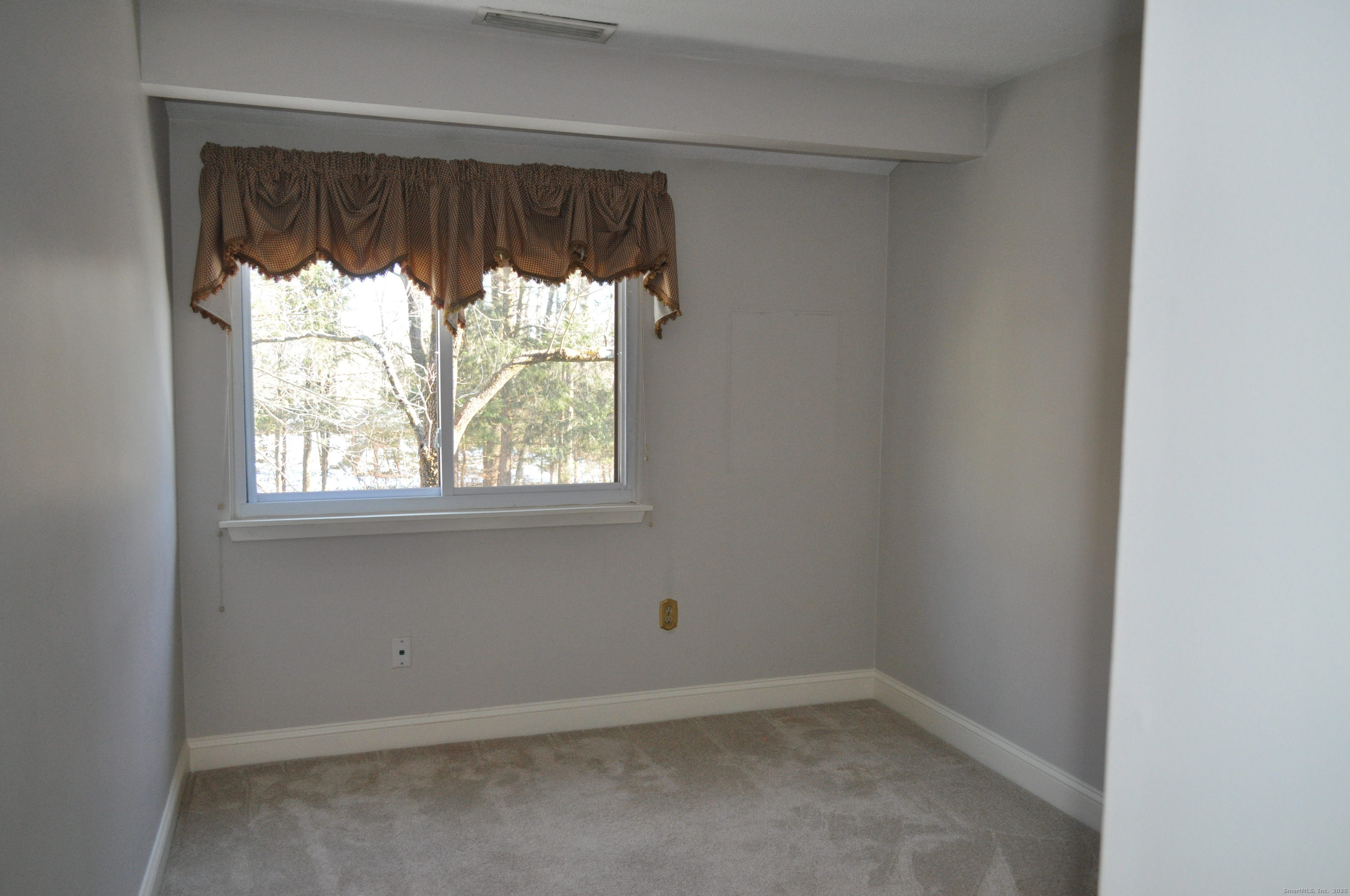 8 Willow Lane, Unit 8 Avon, CT 06001 - Photo 12 of 15 an empty room with a window
