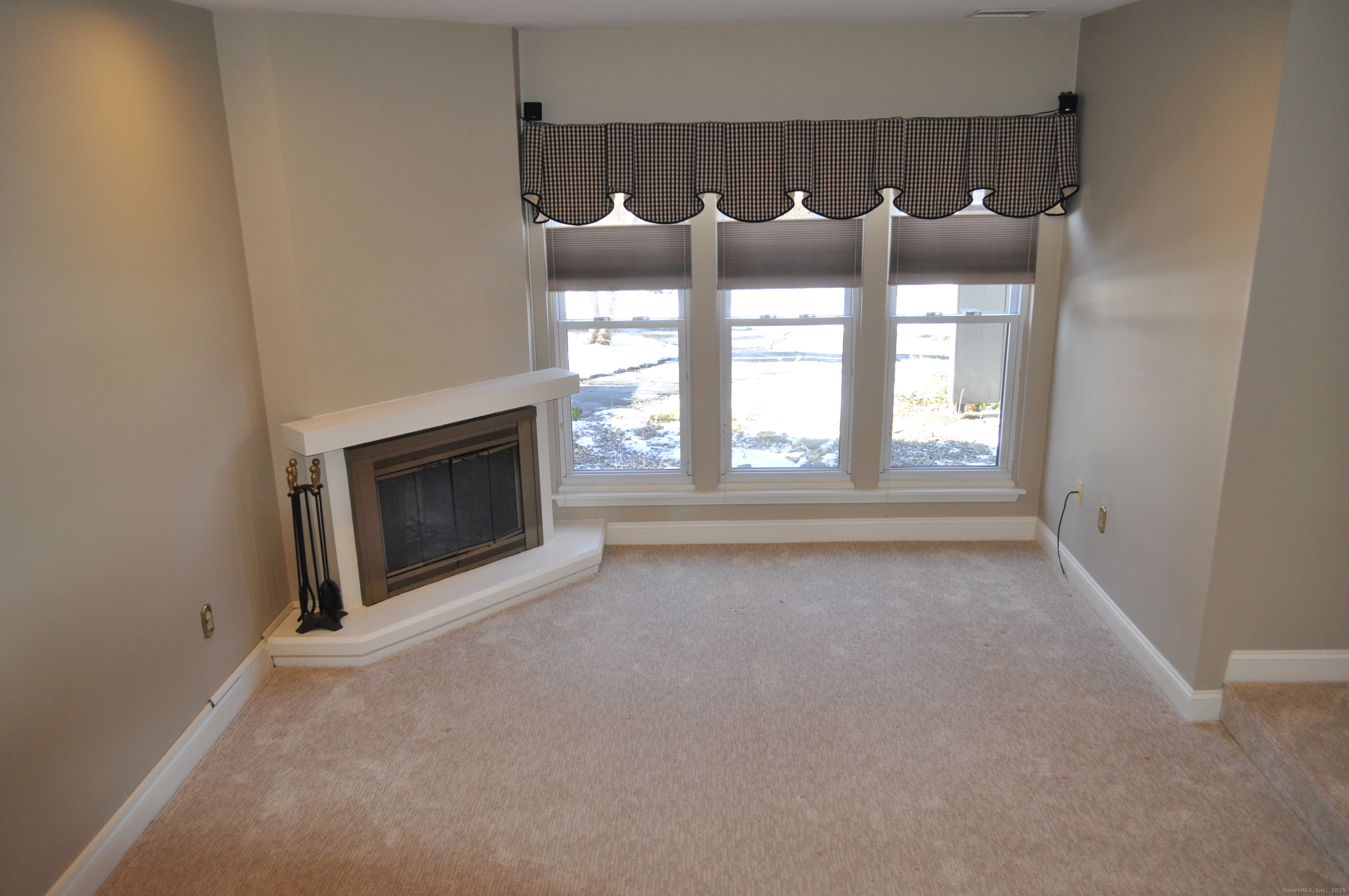 8 Willow Lane, Unit 8 Avon, CT 06001 - Photo 13 of 15 a view of fireplace and window in a room