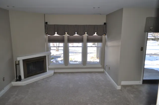 a room with a fireplace and a bed