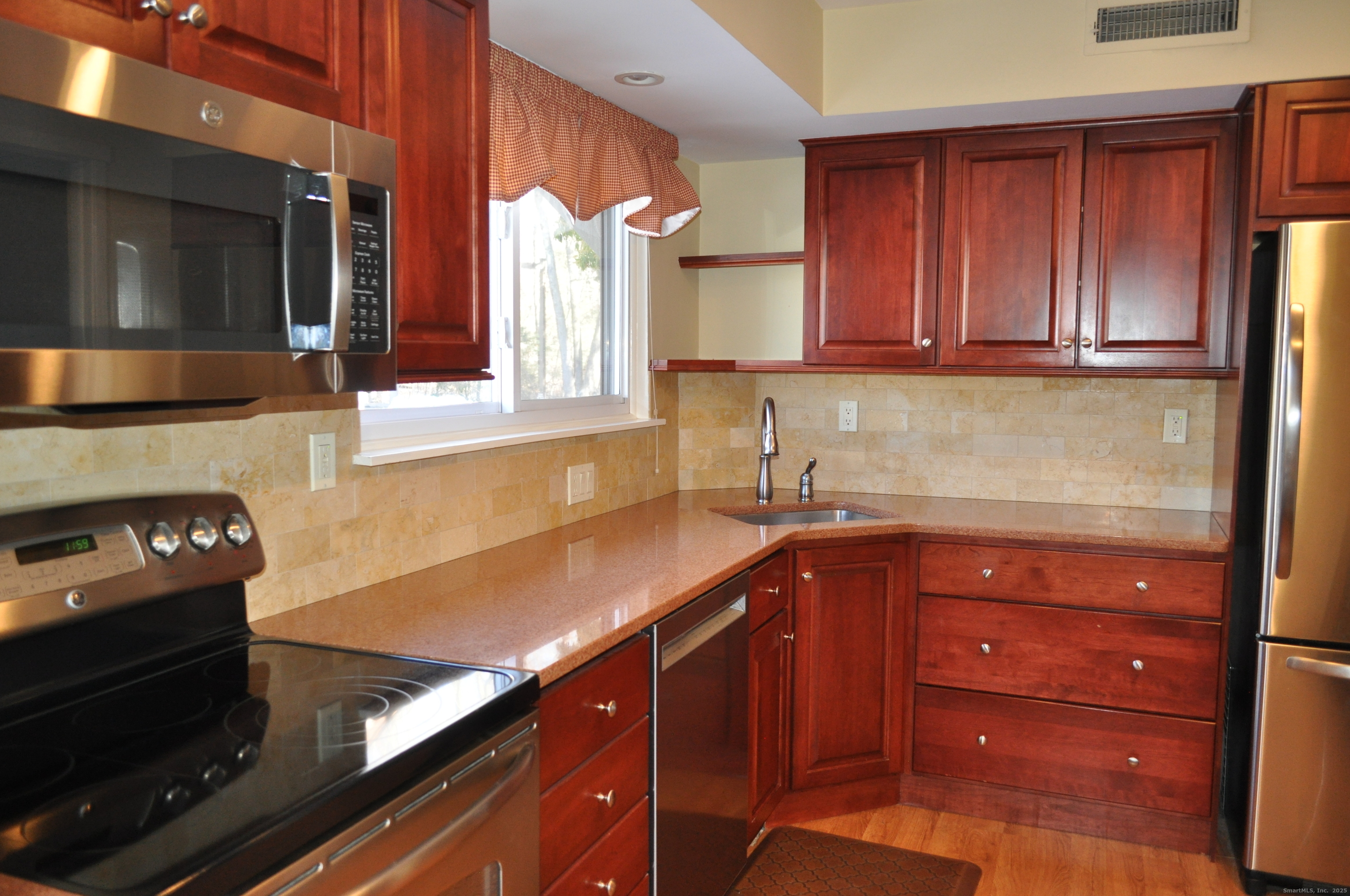 8 Willow Lane, Unit 8 Avon, CT 06001 - Photo 5 of 15 a kitchen with a sink and cabinets