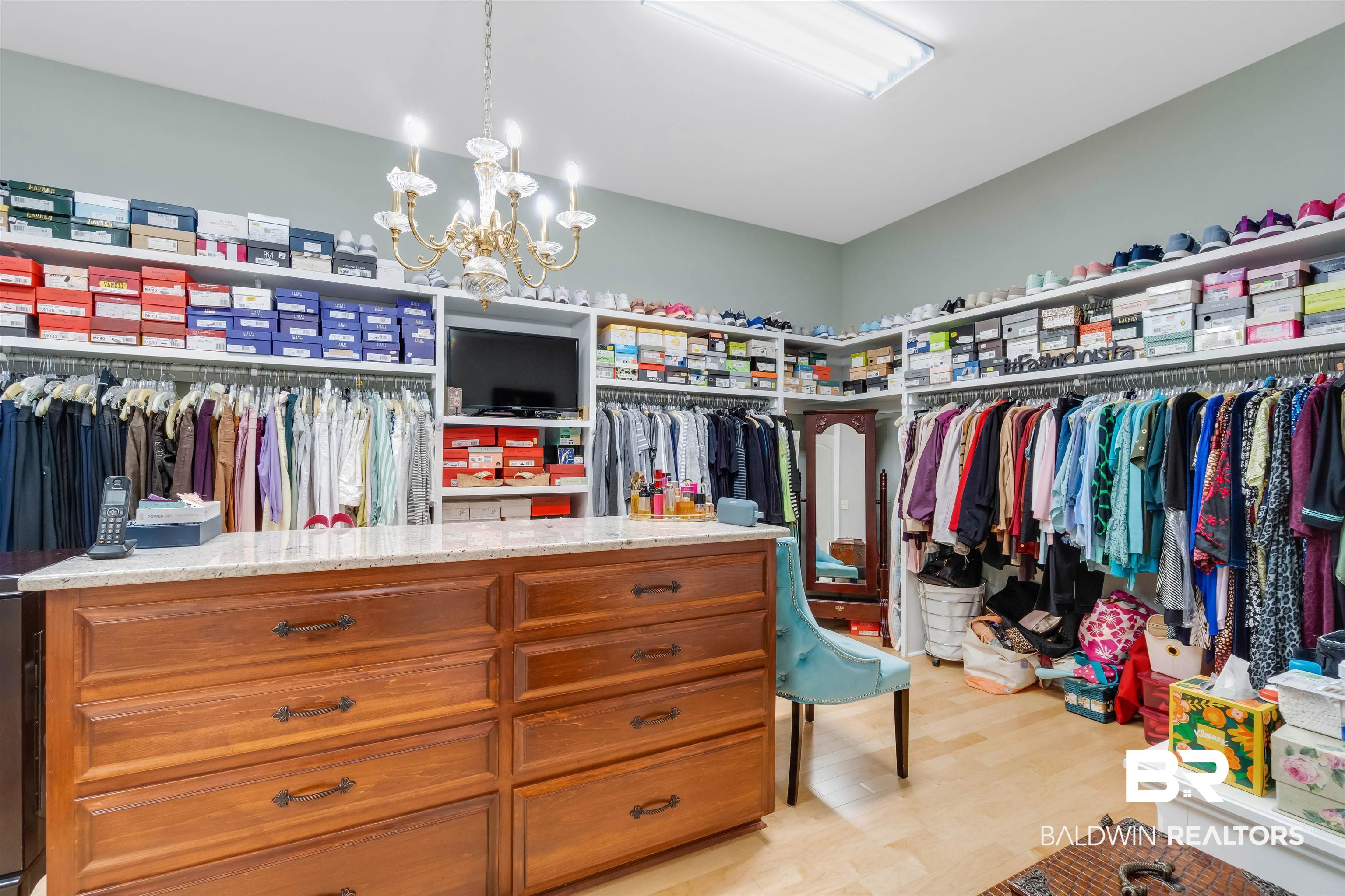 11281 Redfern Road Daphne, AL 36526 - Photo 38 of 80 Spacious closet featuring light wood-type flooring and an inviting chandelier