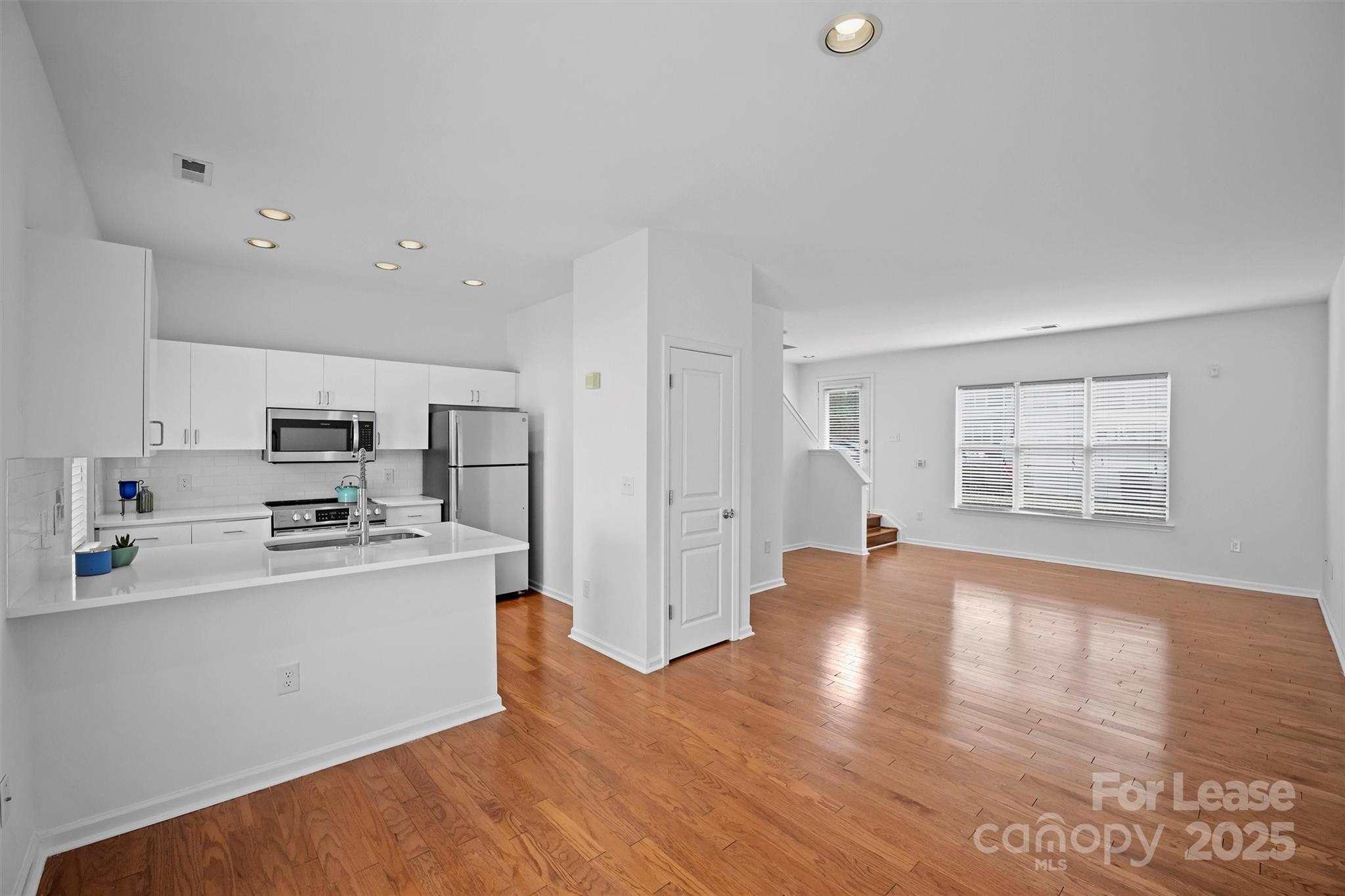 2252 Vision Drive Charlotte, NC 28203 - Photo 11 of 30 a kitchen with stainless steel appliances granite countertop a refrigerator and a stove top oven
