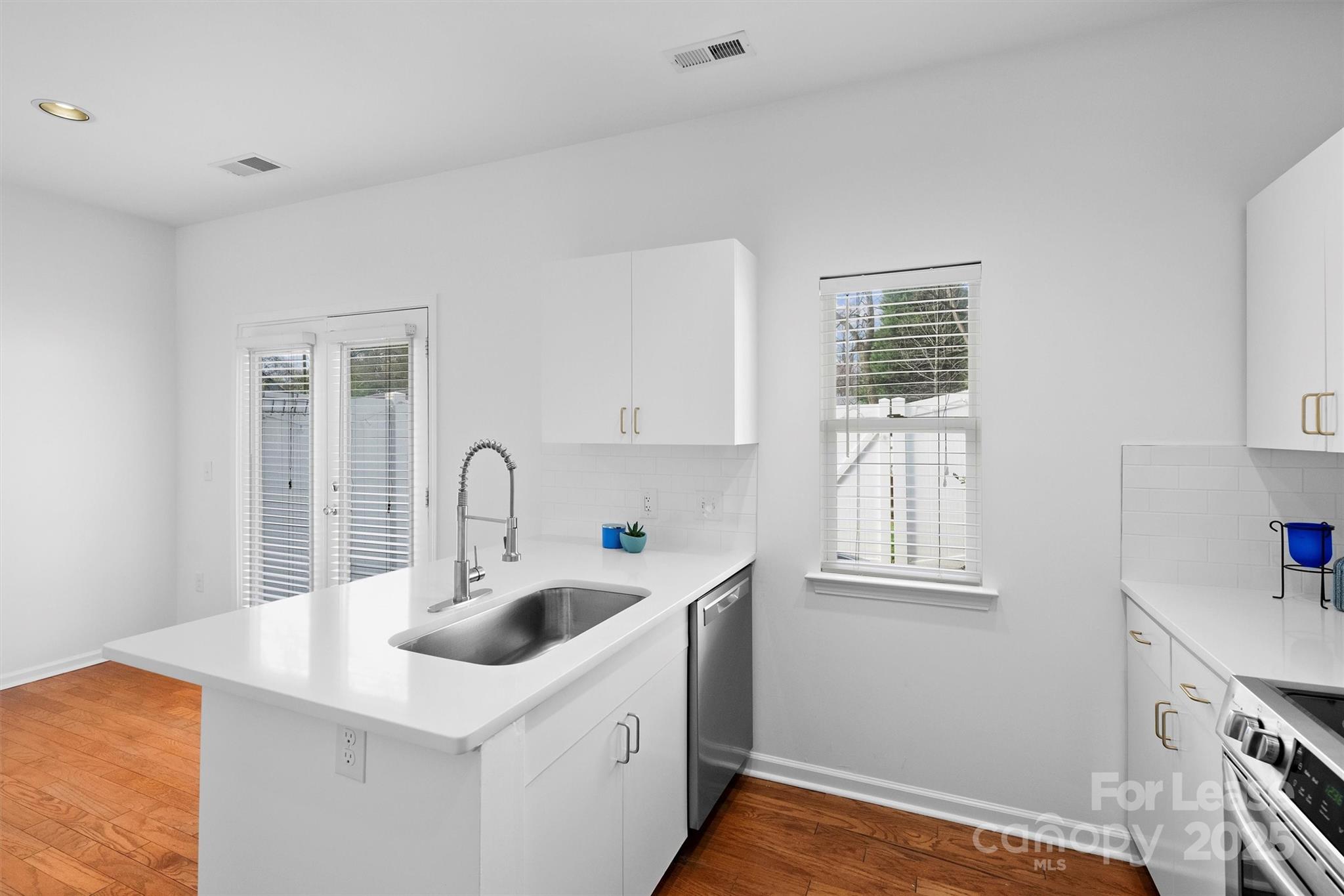 2252 Vision Drive Charlotte, NC 28203 - Photo 14 of 30 a kitchen with a sink cabinets and a window