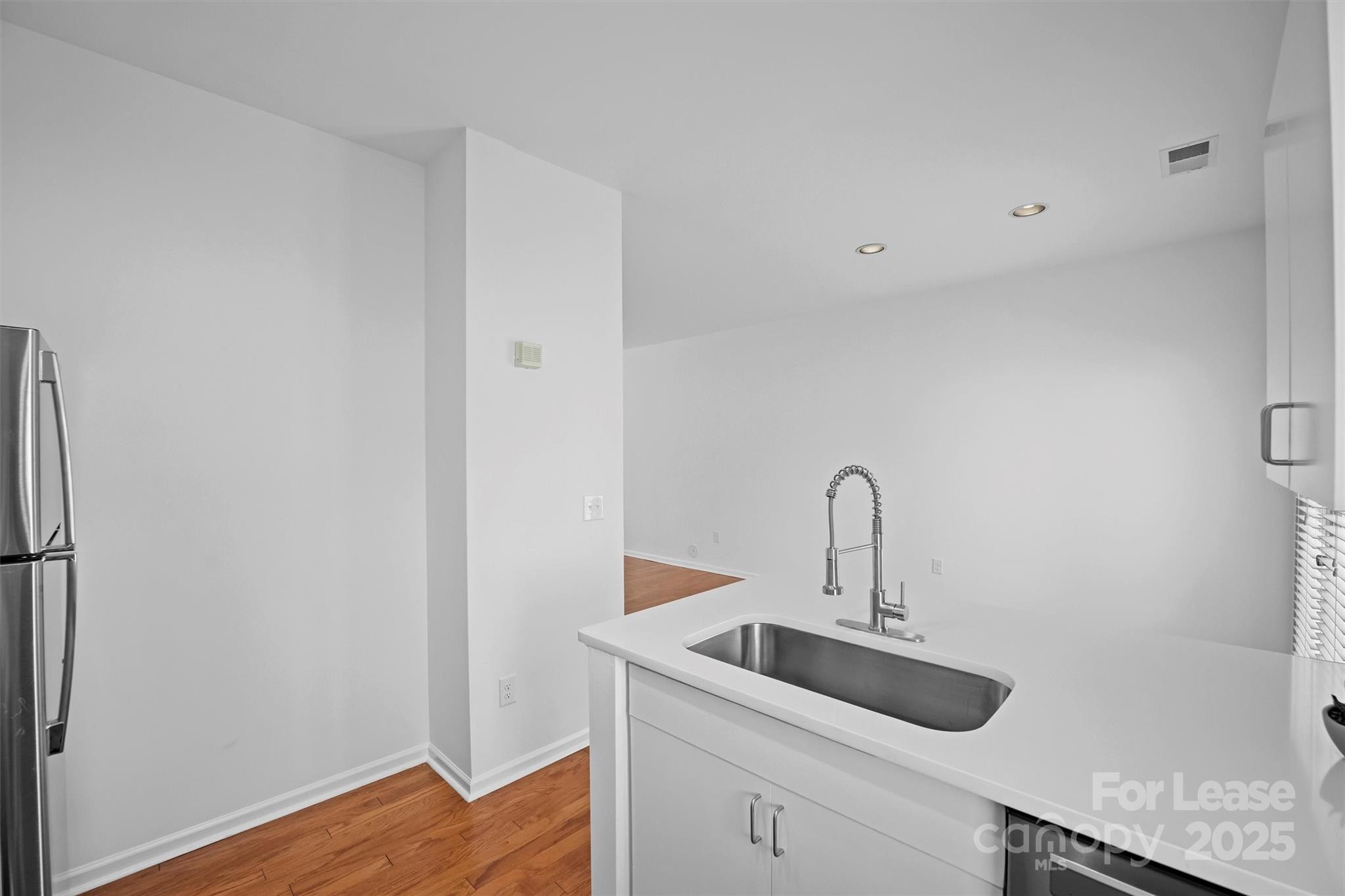 2252 Vision Drive Charlotte, NC 28203 - Photo 15 of 30 a kitchen with a sink and refrigerator