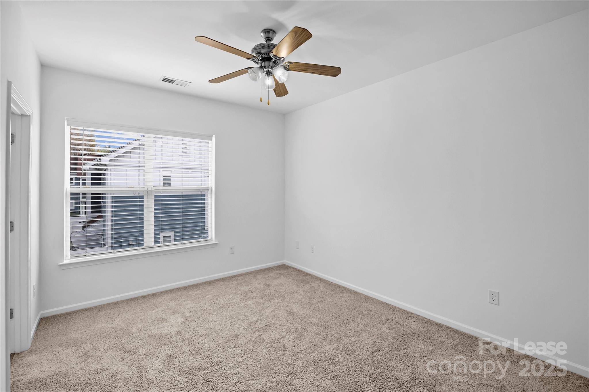 2252 Vision Drive Charlotte, NC 28203 - Photo 18 of 30 an empty room with a window