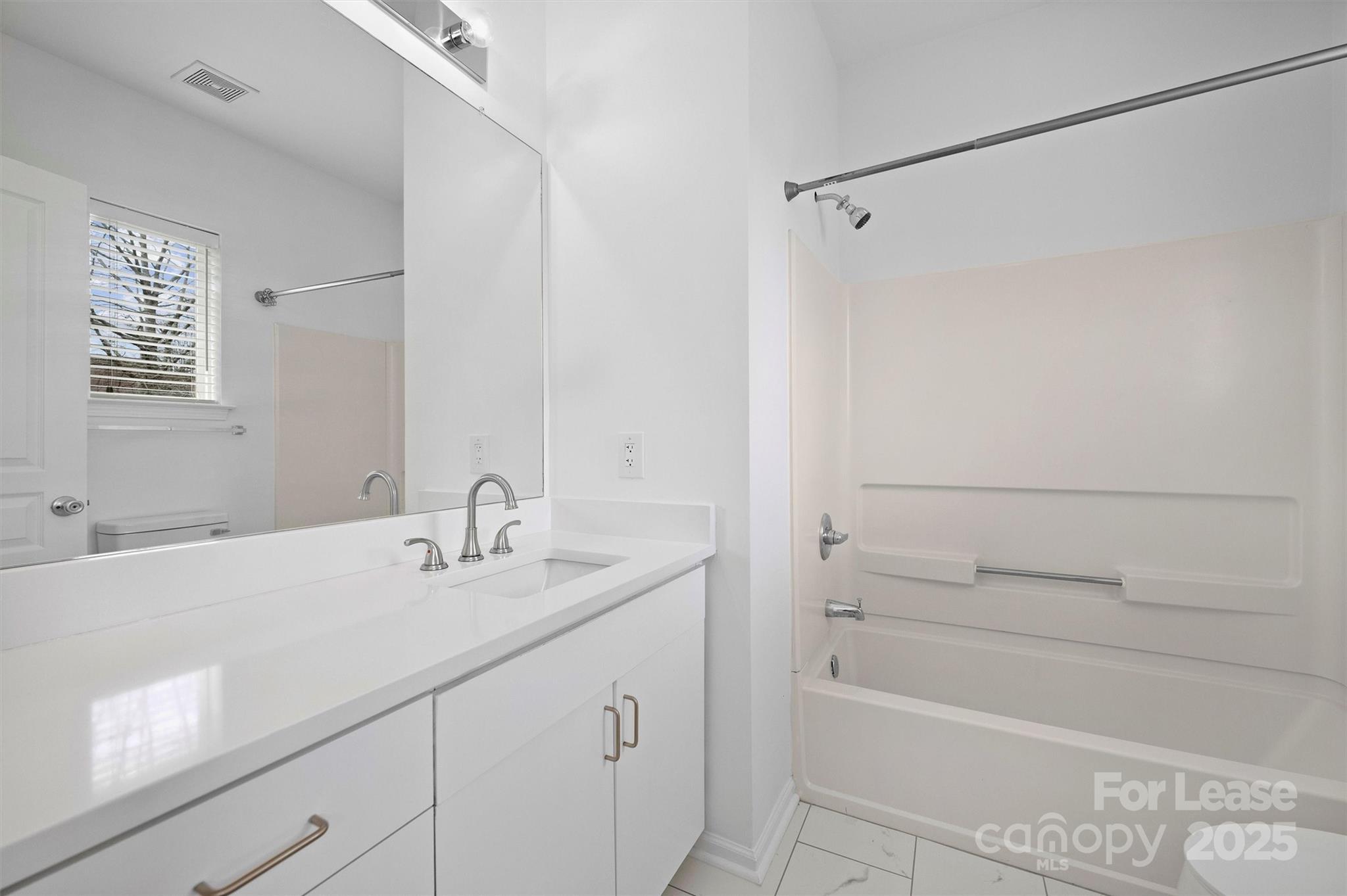 2252 Vision Drive Charlotte, NC 28203 - Photo 21 of 30 a bathroom with a sink and a shower