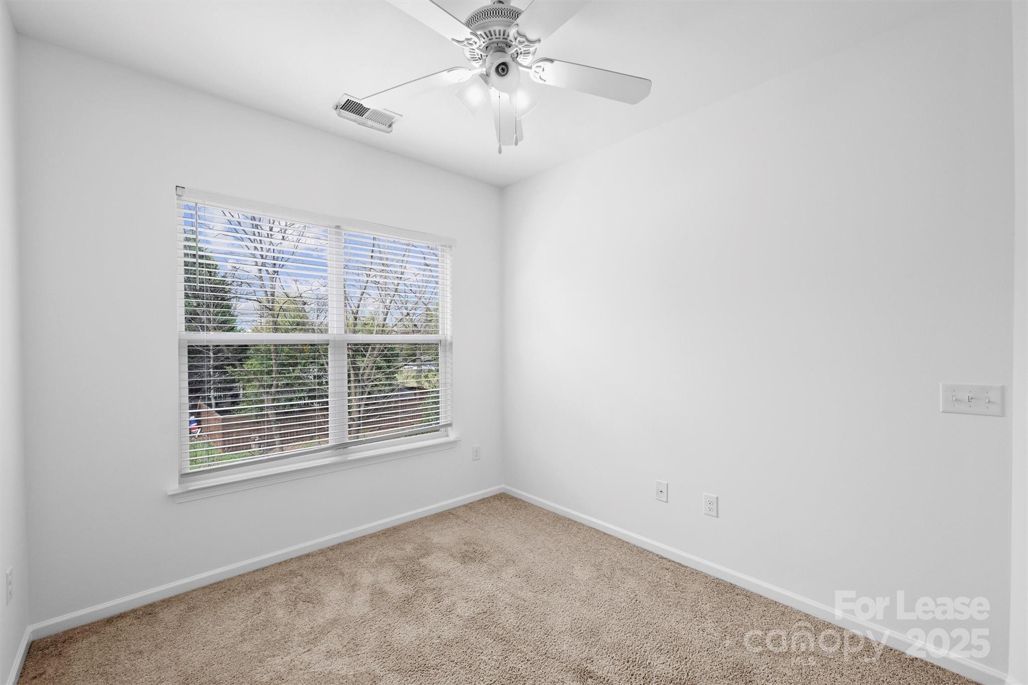 2252 Vision Drive Charlotte, NC 28203 - Photo 25 of 30 a view of an empty room with a window