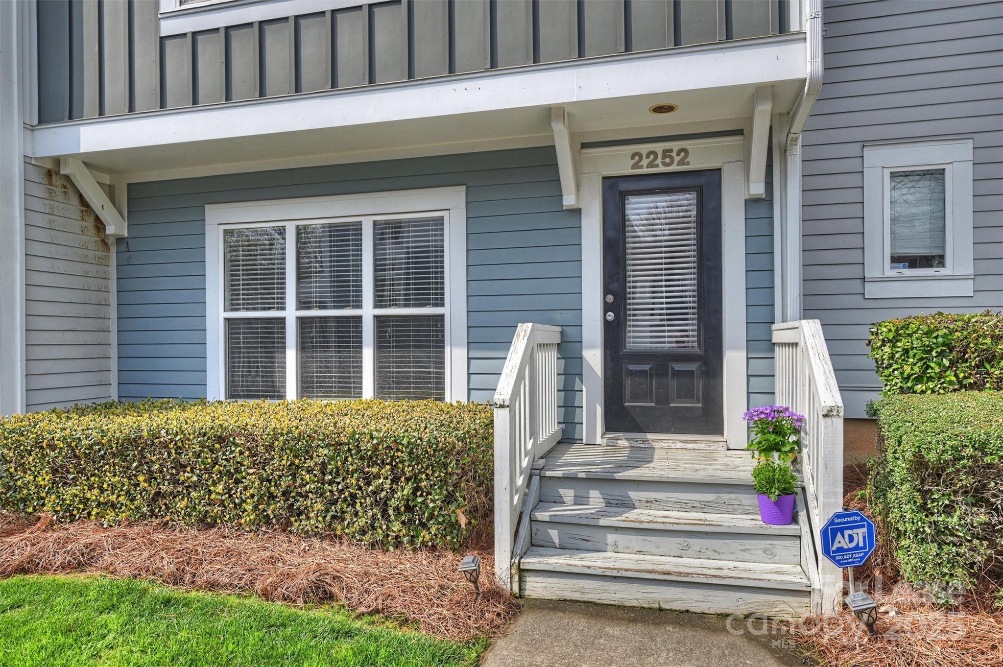 2252 Vision Drive Charlotte, NC 28203 - Photo 3 of 30 a front view of a house with a garden