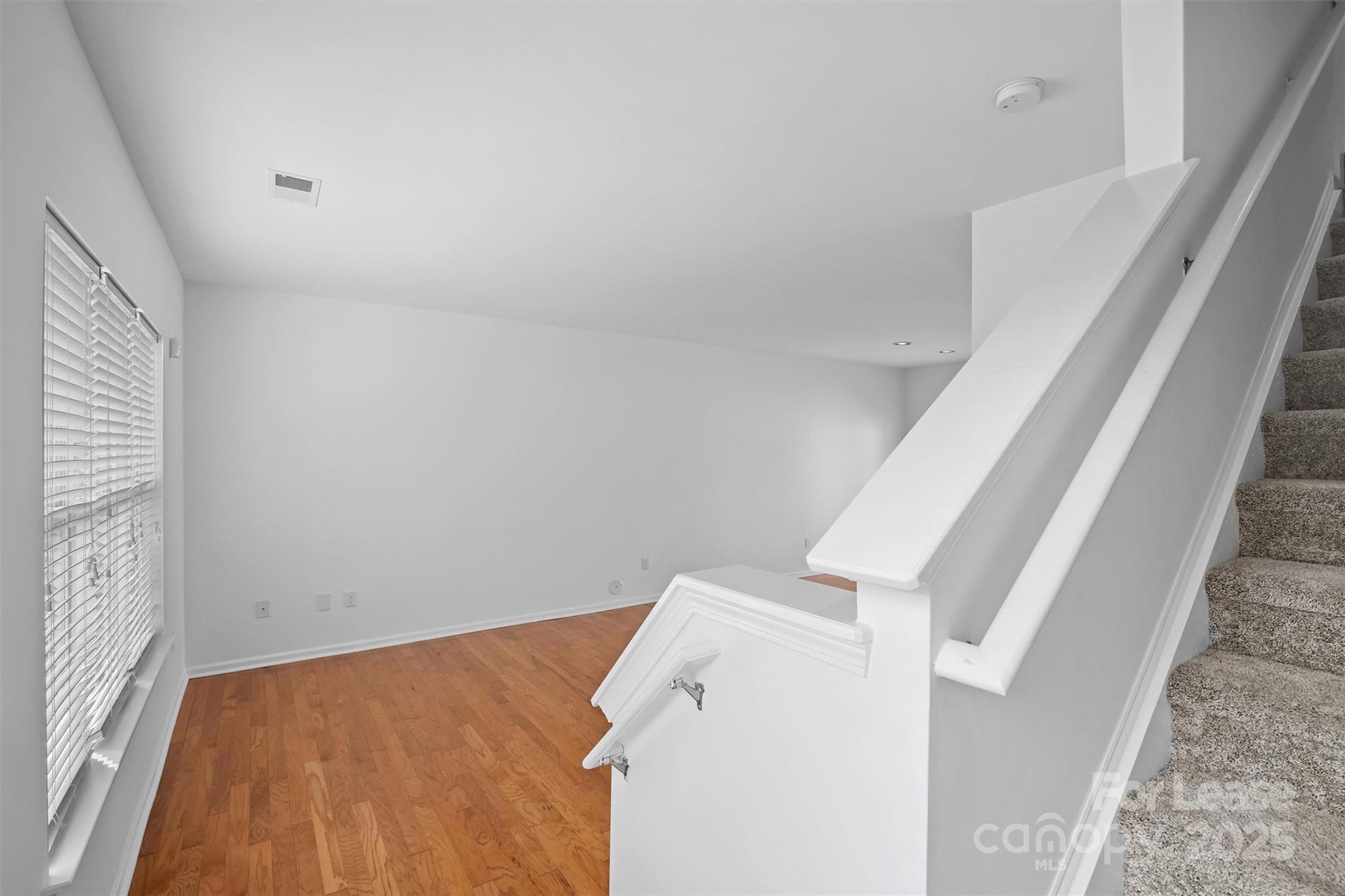 2252 Vision Drive Charlotte, NC 28203 - Photo 4 of 30 a view of a room with staircase and white walls