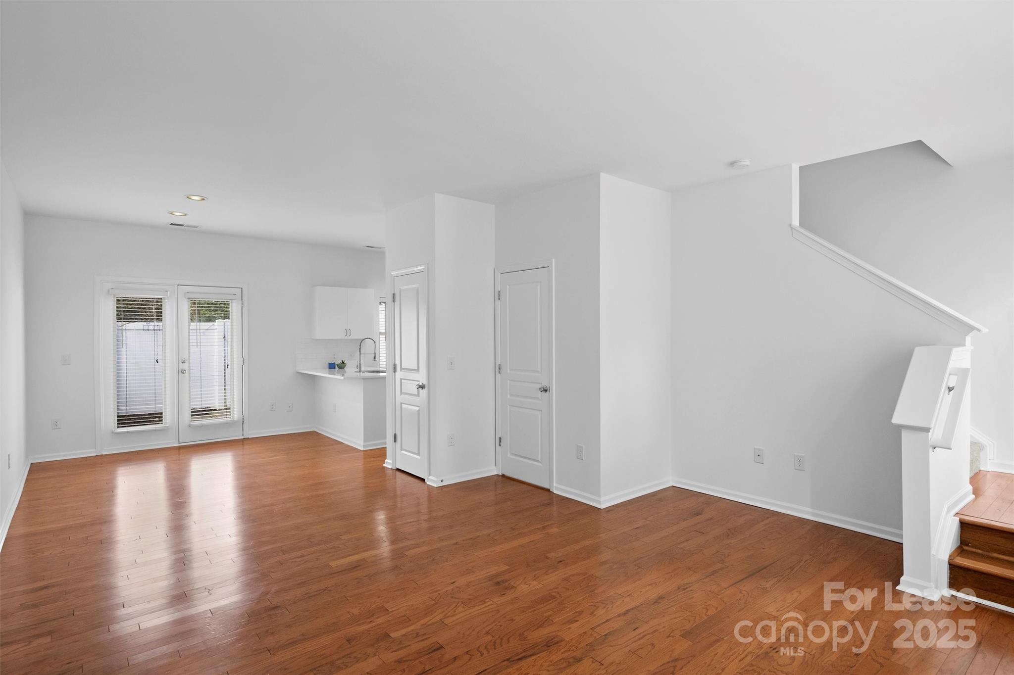 2252 Vision Drive Charlotte, NC 28203 - Photo 6 of 30 a view of a big room with wooden floor and windows