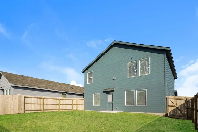 a view of front of house with a yard