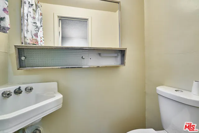 a bathroom with a bathtub and a toilet