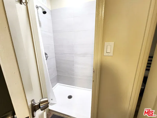 a bathroom with a tub and a shower
