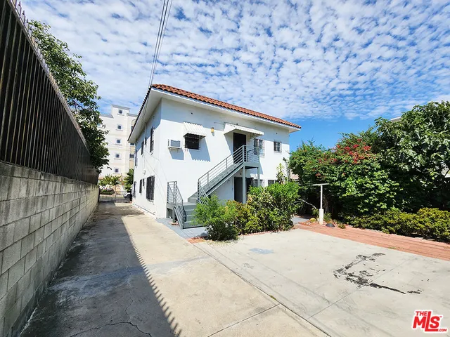 a house with trees in the background