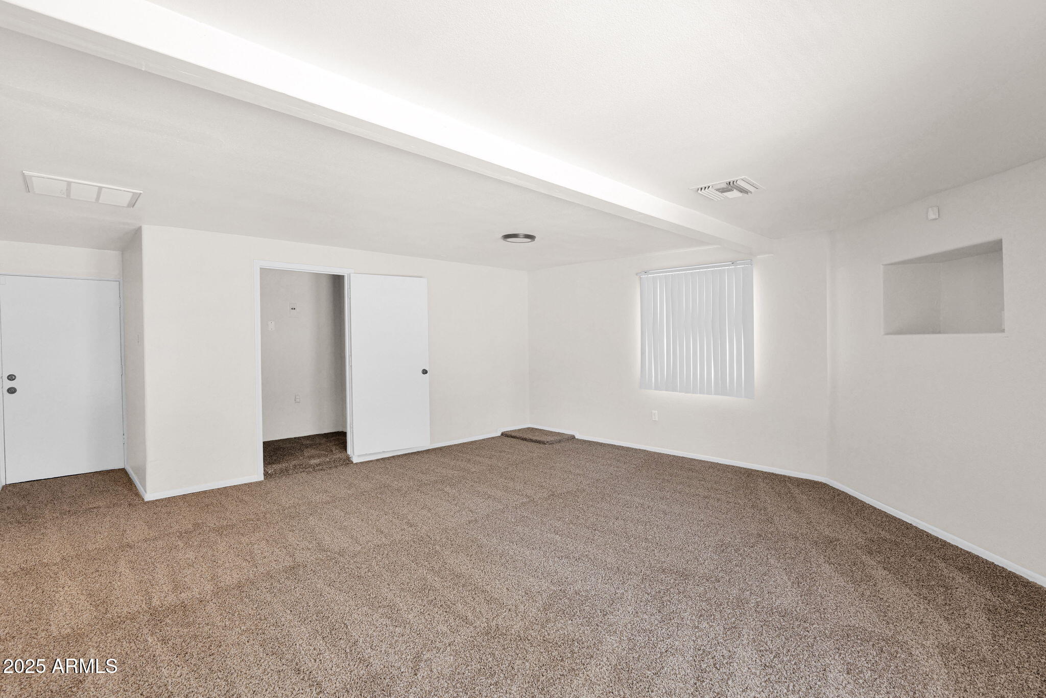 7221 Virginia Avenue Phoenix, AZ 85035 - Photo 14 of 33 a view of an empty room with a window