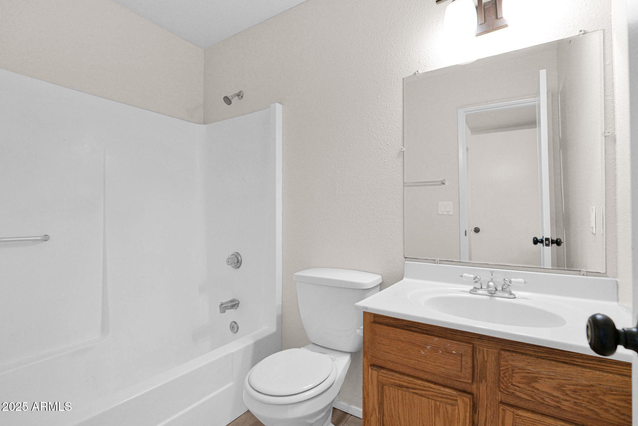 7221 Virginia Avenue Phoenix, AZ 85035 - Photo 19 of 33 a bathroom with a sink a toilet and shower