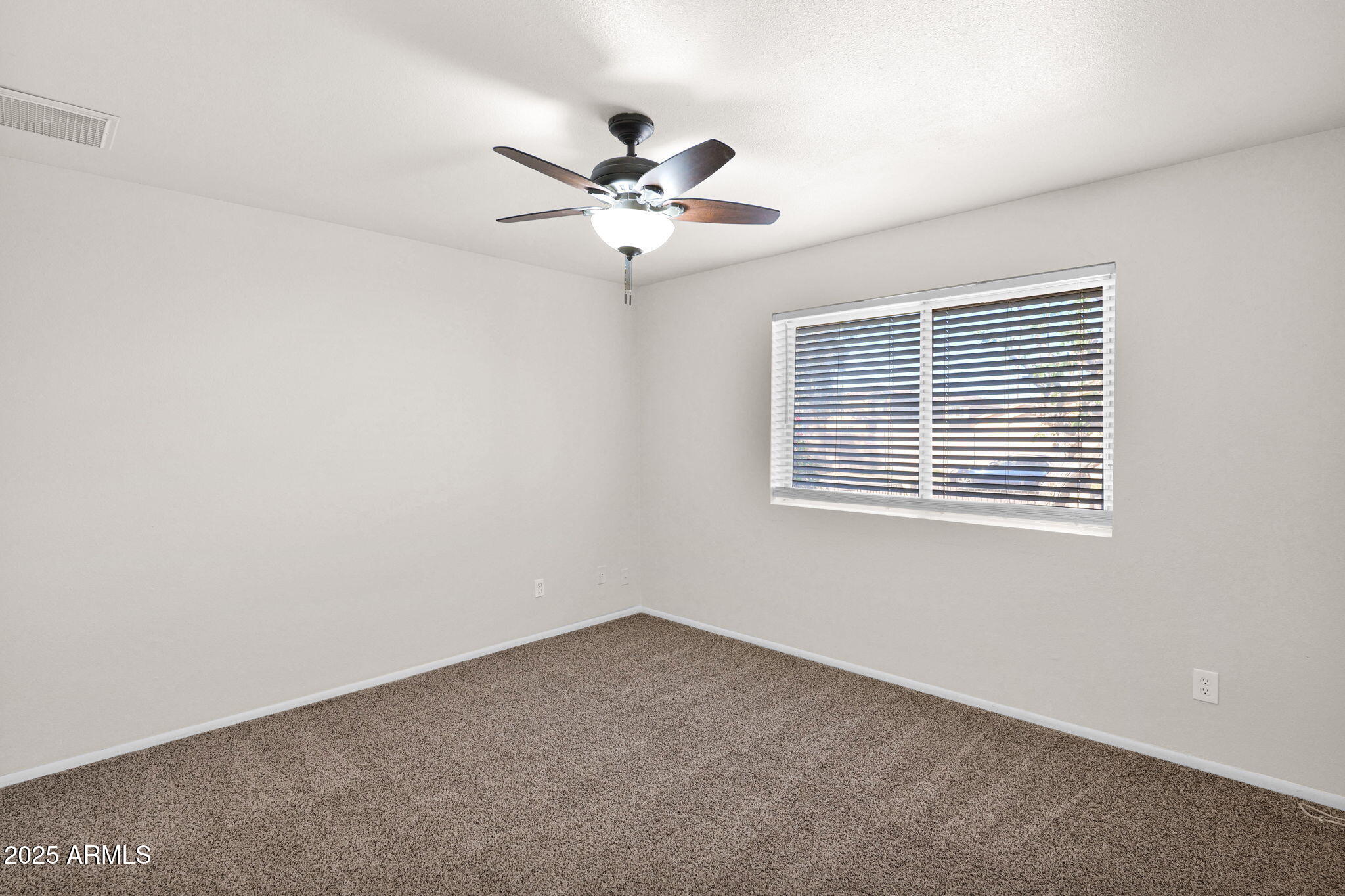 7221 Virginia Avenue Phoenix, AZ 85035 - Photo 20 of 33 a view of an empty room with a window